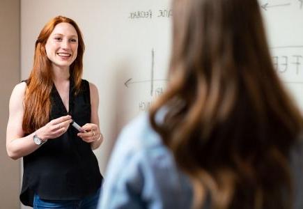 Professor talking to student